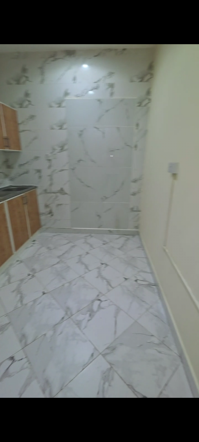 Two bedrooms and a living room in Mohammed Bin Zayed City