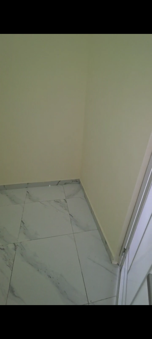 Two bedrooms and a living room in Mohammed Bin Zayed City