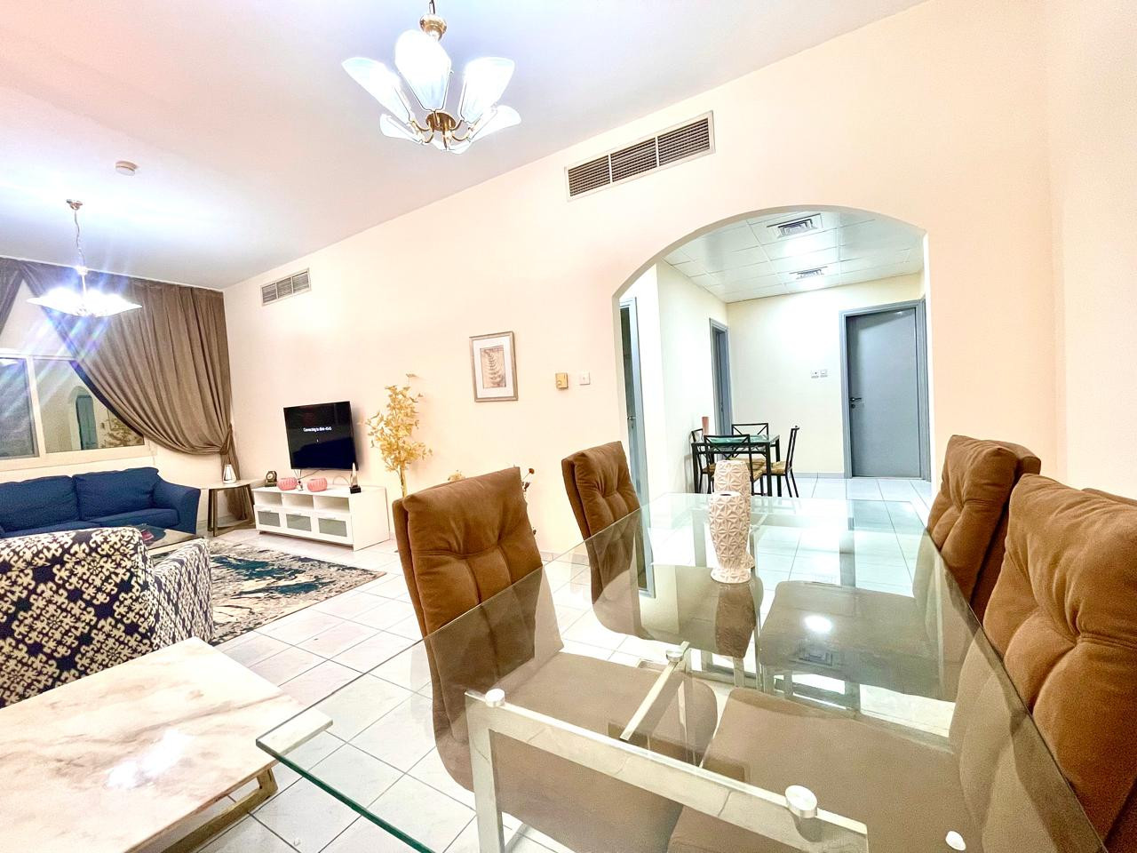 Two bedrooms and a living room with a balcony in Al Qasba