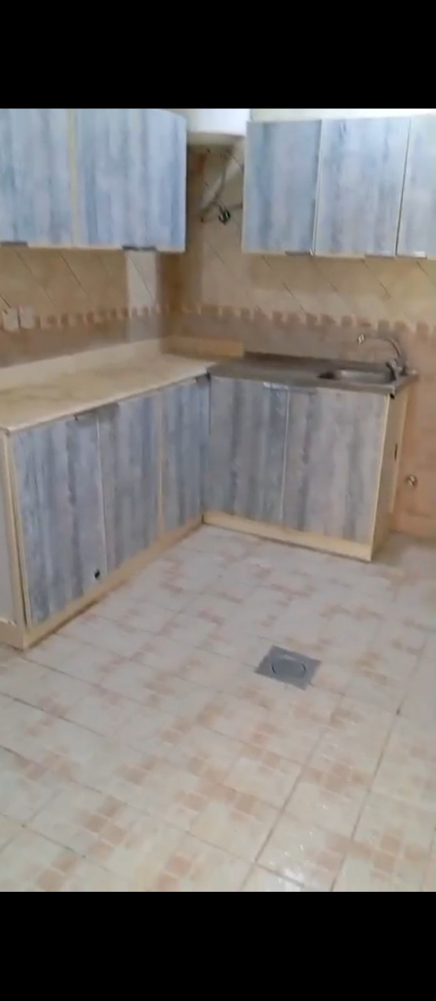 Two bedrooms, a living room, a bathroom, and a separate kitchen.