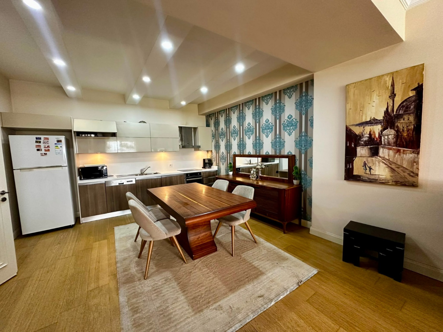 Two bedrooms and a living room with a view of the highway.