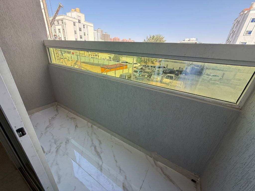 Two bedrooms, a living room with a balcony, and two bathrooms in Al-Nuaimiya 2