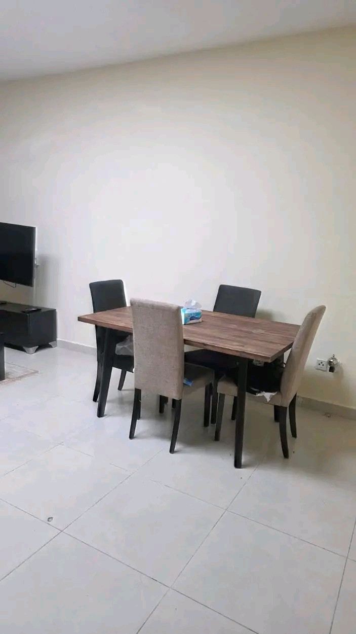 Two bedrooms and a living room with a balcony in Ajman