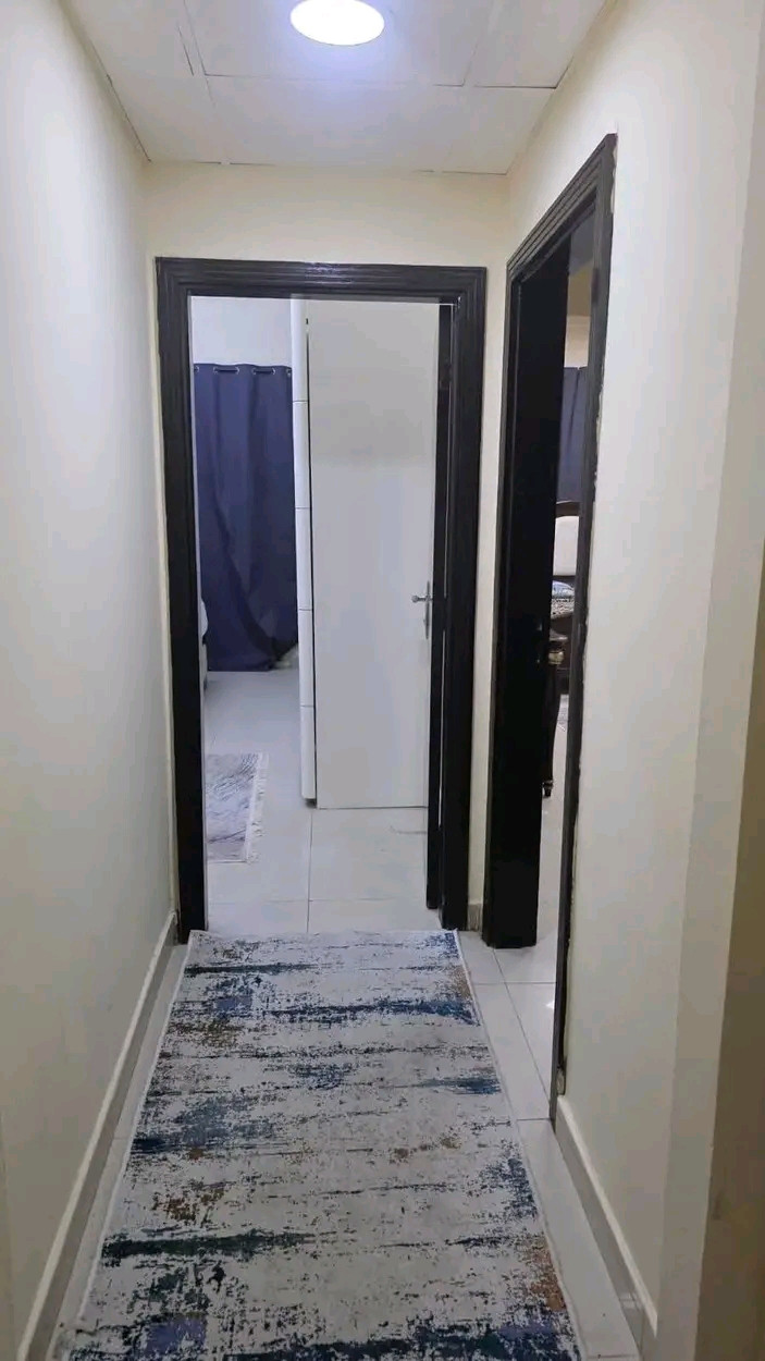 Two bedrooms and a living room with a balcony in Ajman