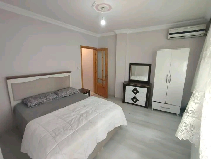 Two fully furnished and air-conditioned bedrooms and a living room