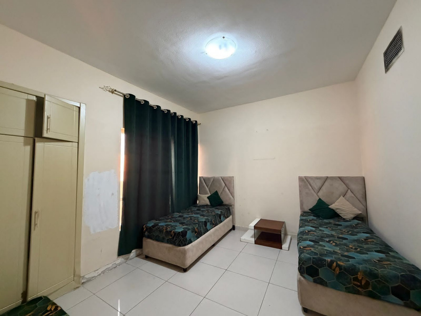 Two bedrooms, a living room, two bathrooms, and a balcony in Al Nuaimiya 1