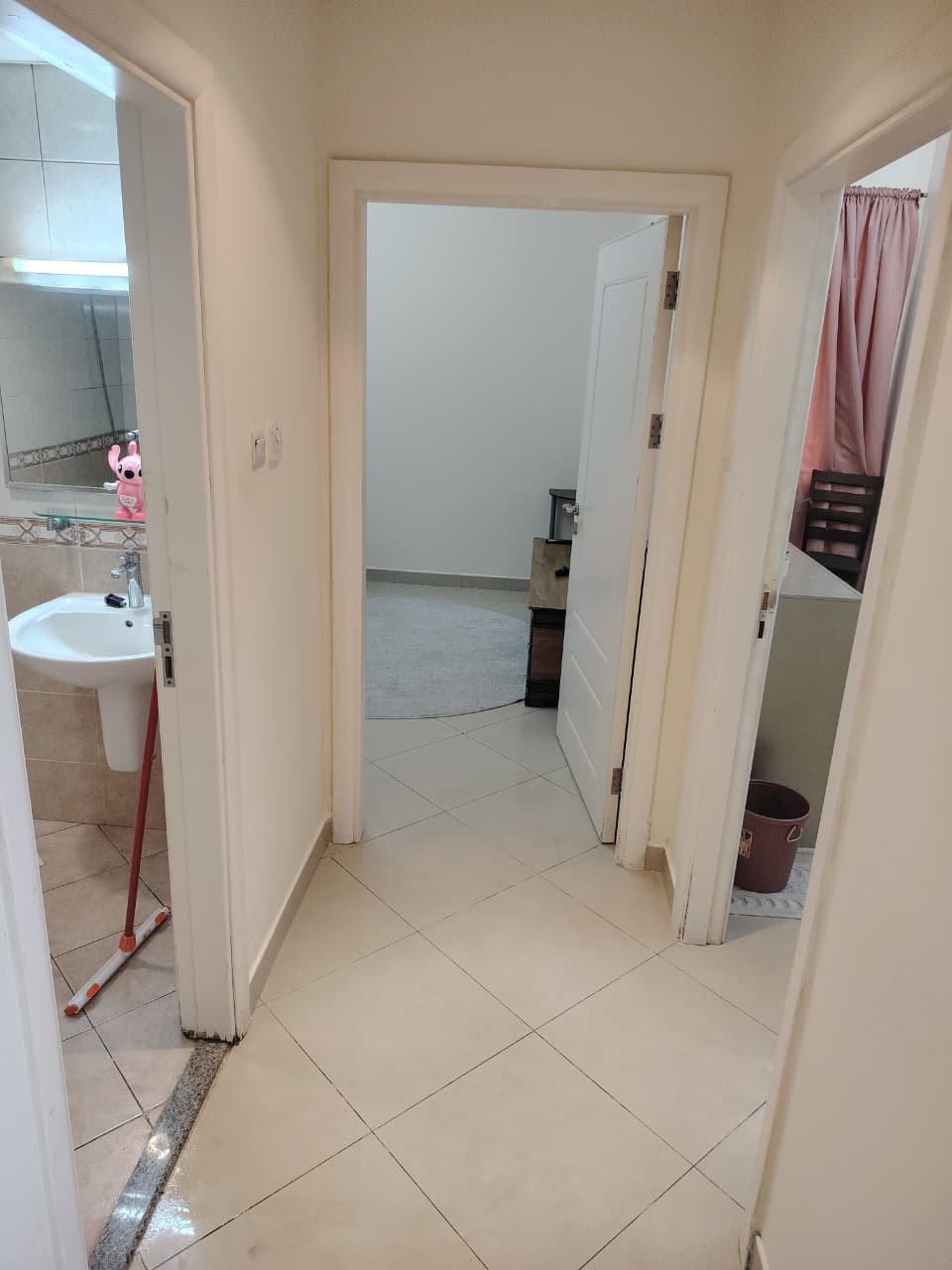 Two bedrooms and a living room, furnished with very clean furniture, and a bathroom.