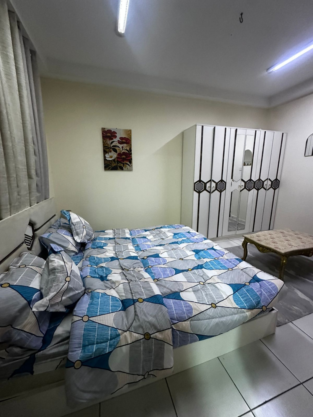 Two bedrooms and a living room, furnished with new furniture