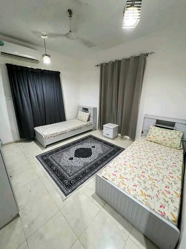 Two bedrooms, a living room, a kitchen, and two bathrooms in Al Ghubra North