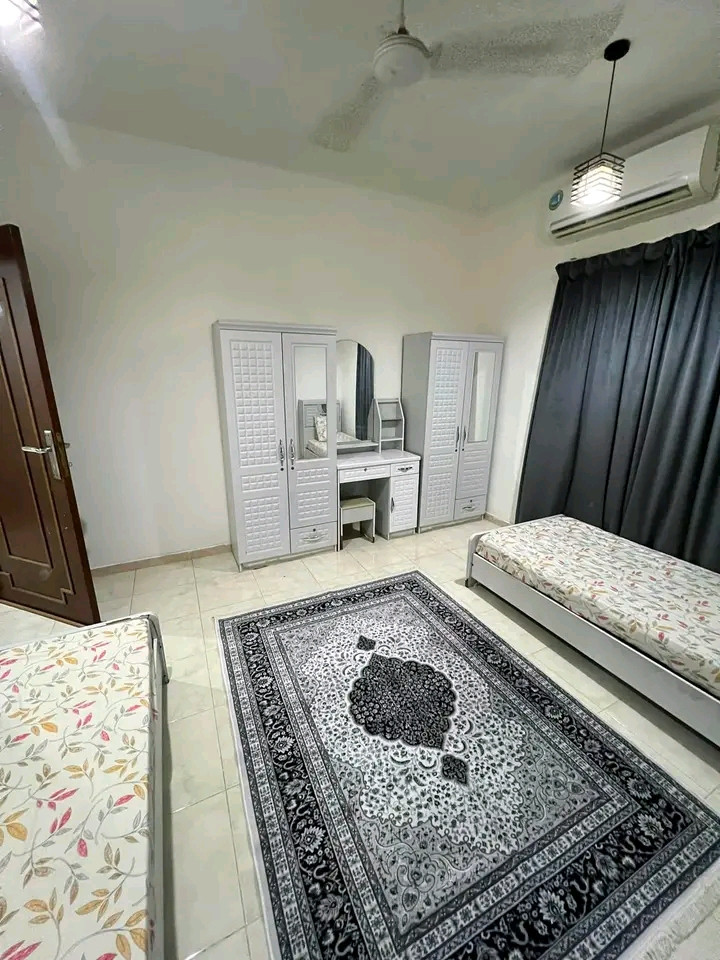 Two bedrooms, a living room, a kitchen, and two bathrooms in Al Ghubra North