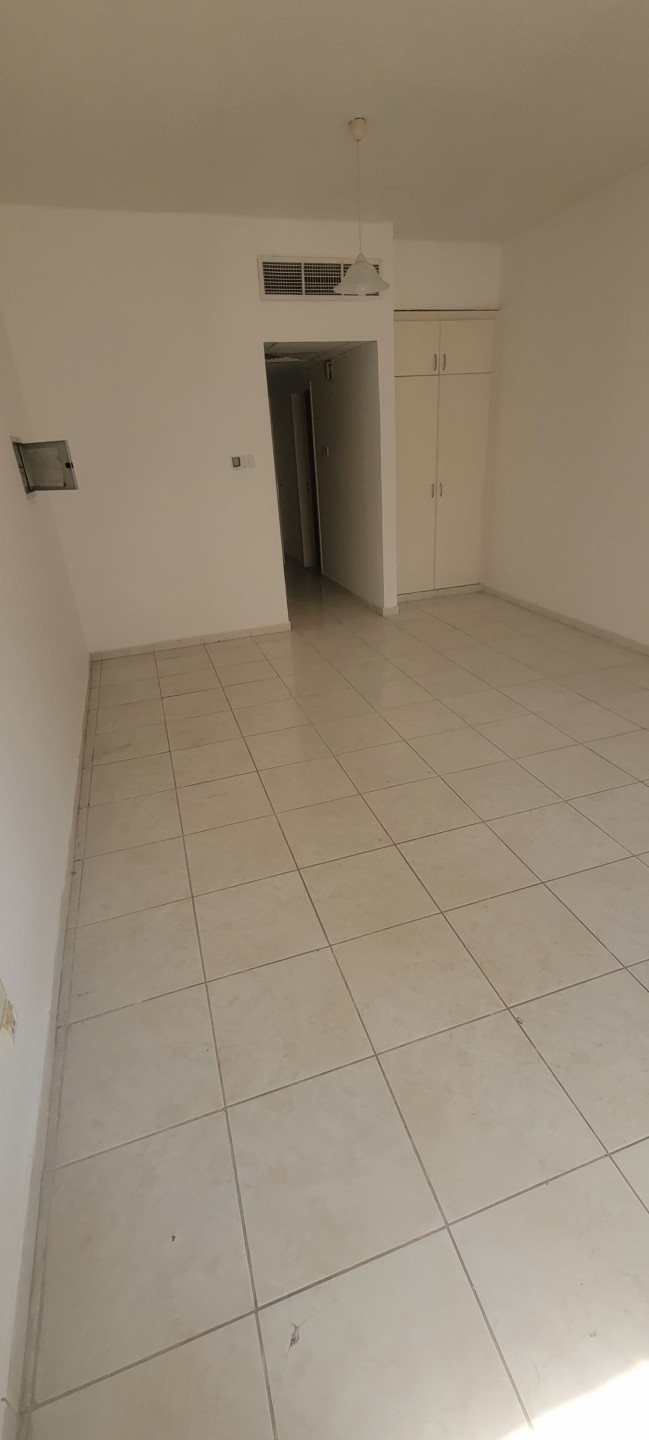 Studio apartment for annual rent in Al Rashidiya, behind Grand Mall, for 20,000 AED payable in 4 or 6 checks.