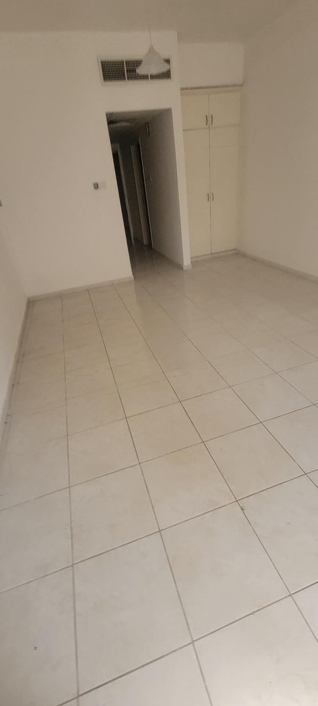 Studio apartment for annual rent in Al Rashidiya, behind Grand Mall, for 20,000 AED payable in 4 or 6 checks.