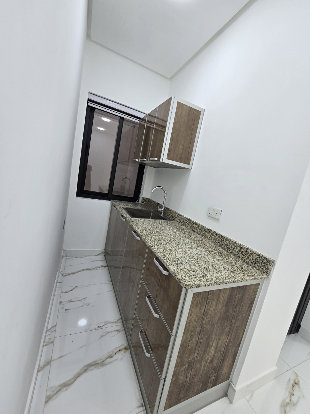 For rent: Brand new furnished studio apartment, electricity included, in Al Badi'