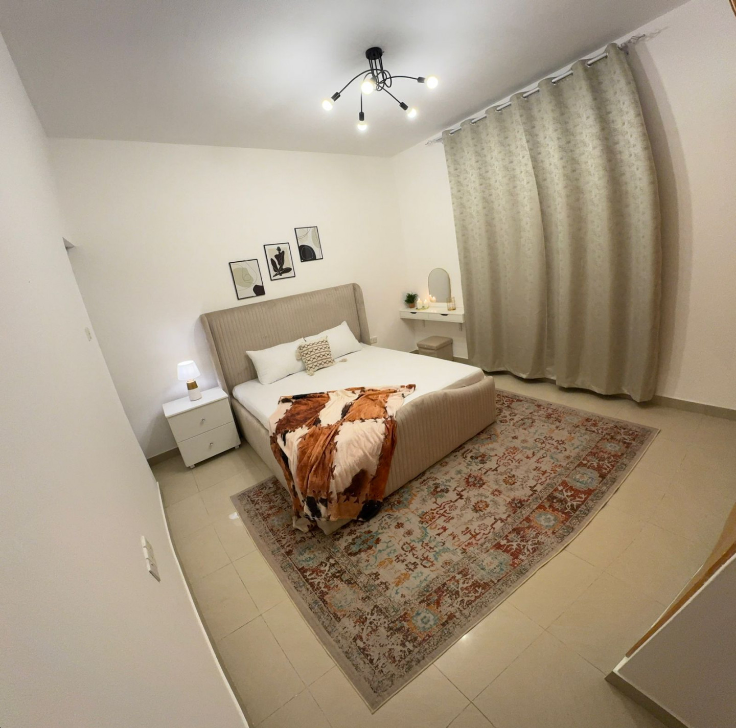 For rent: One bedroom and living room in Sharjah, Al Majara area, with a balcony, great view, and hotel-style furnishings.