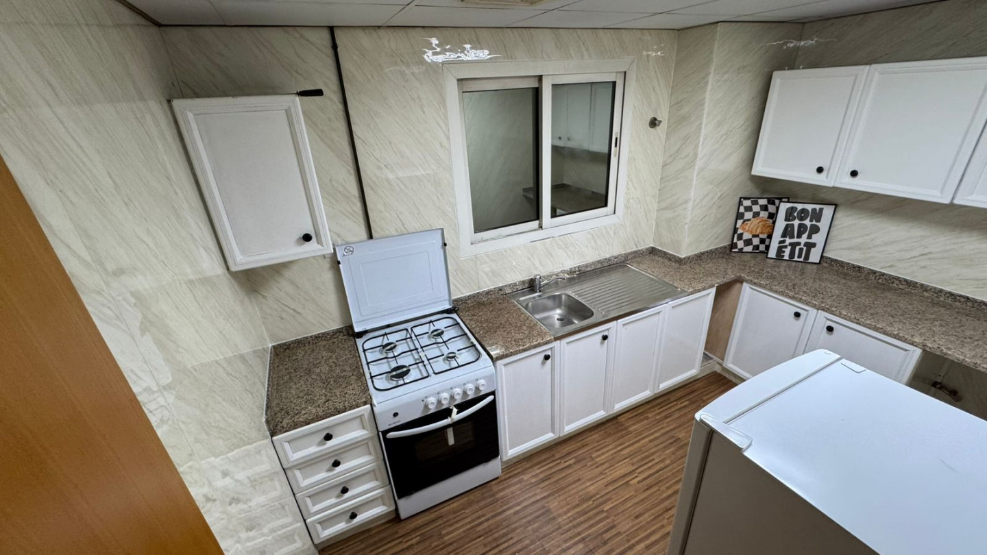 For rent: One bedroom and living room in Sharjah, Al Majara area, with a balcony, great view, and hotel-style furnishings.