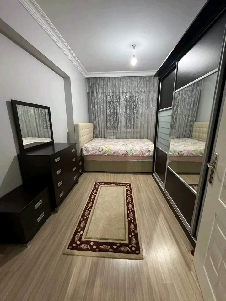 A vacant 1.5+1 apartment is available for rent. It features an American-style kitchen, is new, and has two bathrooms.