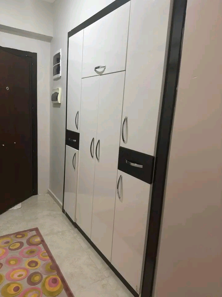A vacant 1.5+1 apartment is available for rent. It features an American-style kitchen, is new, and has two bathrooms.