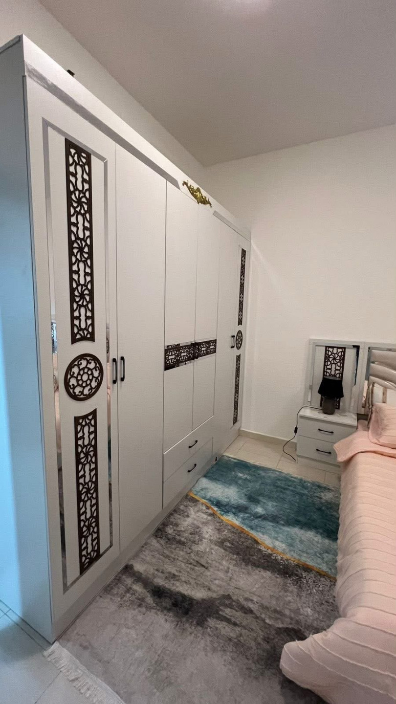 A great deal on a furnished one-bedroom apartment with a living room, clean furnishings, in a family-friendly building.