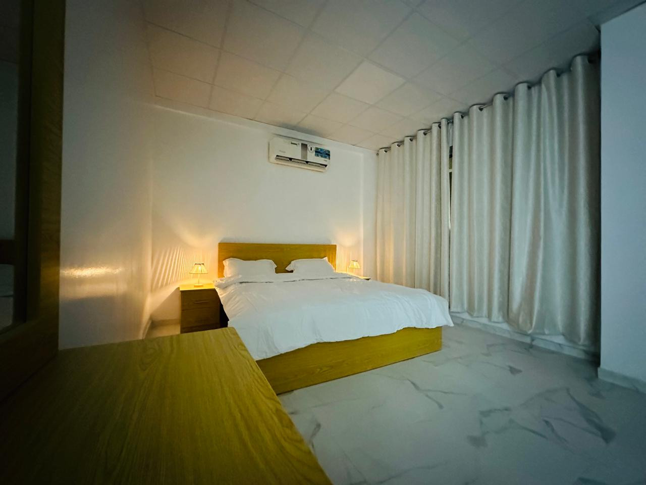 One-bedroom apartment with a living room, fully furnished with new furniture.