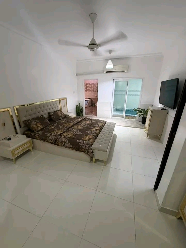 A distinctive apartment in Al Maabilah with an indoor pool