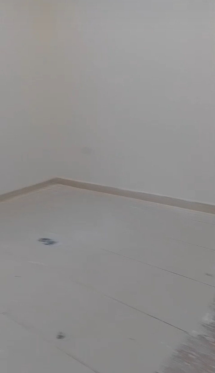 A distinctive apartment with a large kitchen and elevator.