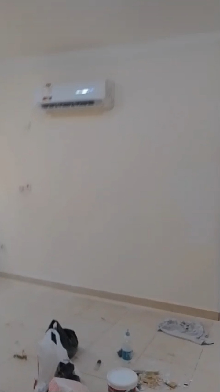 A distinctive apartment with a large kitchen and elevator.