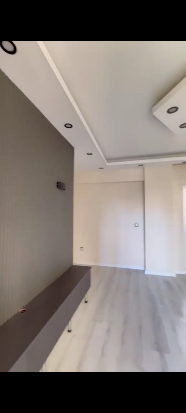 A clean apartment furnished with modern decor.
