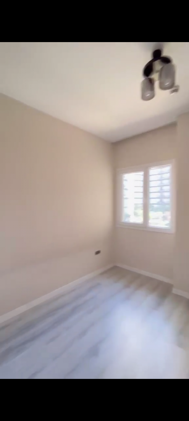 A clean apartment furnished with modern decor.