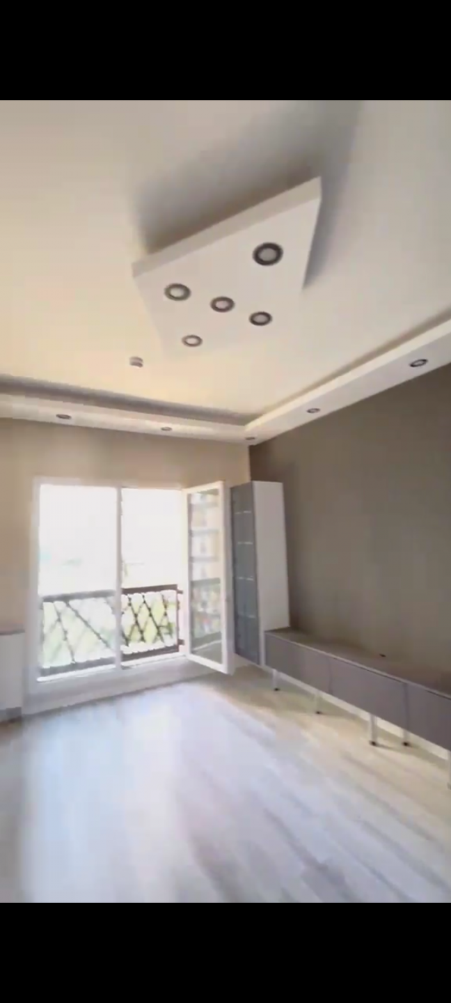 A clean apartment furnished with modern decor.